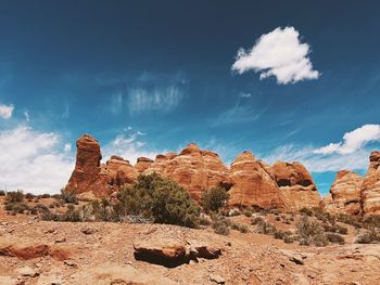 Rock formations on landscape against sky