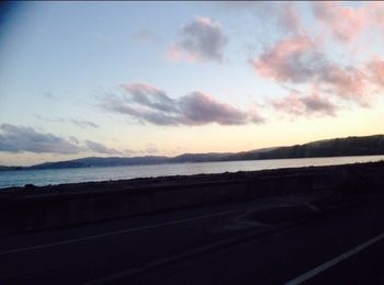 Scenic view of landscape against cloudy sky