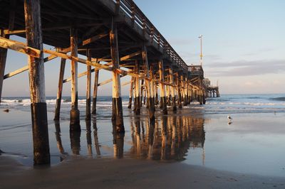 Pier on sea against sky