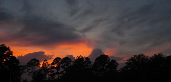 Low angle view of cloudy sky at sunset