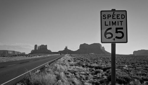 Information sign on road against clear sky