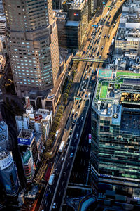 High angle view of illuminated buildings in city at night