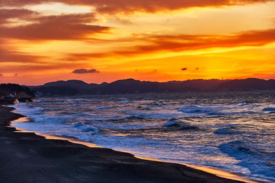 Scenic view of sea against sky during sunset