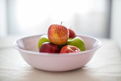 Close-up of fruits in bowl on table