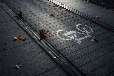 High angle view of people walking on footpath