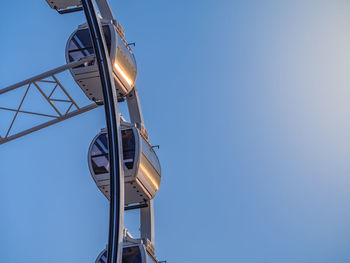 Low angle view of street light against clear blue sky