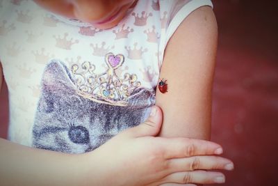 Midsection of woman holding hands