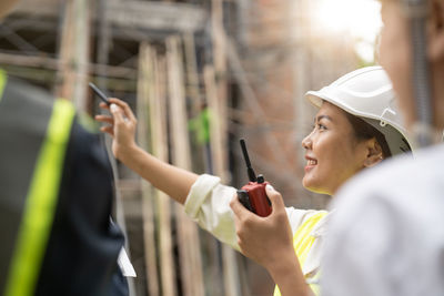 Side view of man using mobile phone