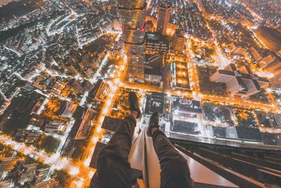 High angle view of city lit up at night