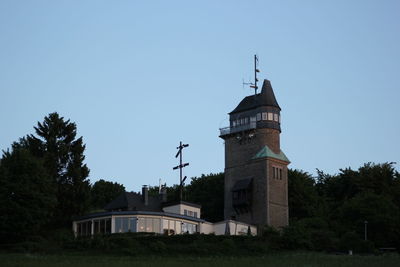 Low angle view of building against clear blue sky