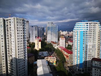 High angle view of buildings in city against sky