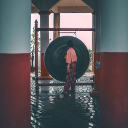 Reflection of man standing in water