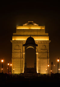 Low angle view of illuminated building against sky