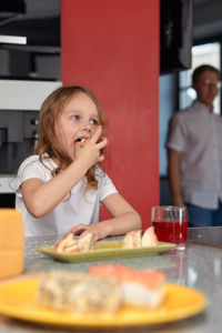 Portrait of smiling woman having food at restaurant