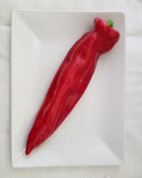 High angle view of red chili peppers on table