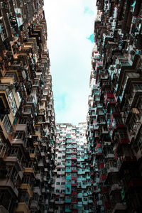 Low angle view of buildings in city against sky