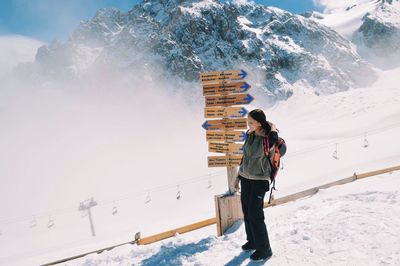 Woman standing in snow