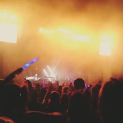 Rear view of people enjoying music concert