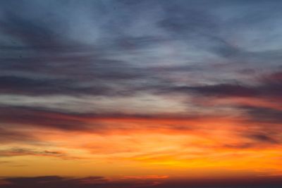 Low angle view of dramatic sky during sunset