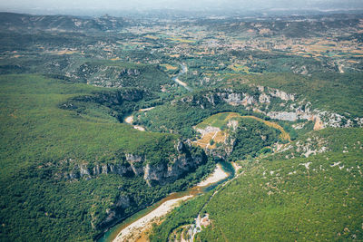 Aerial view of river flowing on landscape