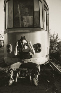 Rear view of man sitting in bus