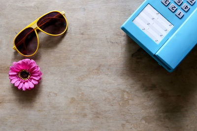 High angle view of pink flower on table