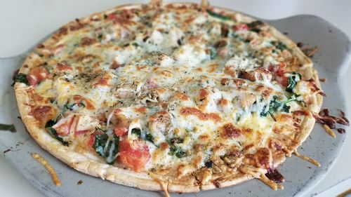 High angle view of pizza in plate on table