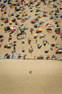 Aerial view of people enjoying vacation at beach