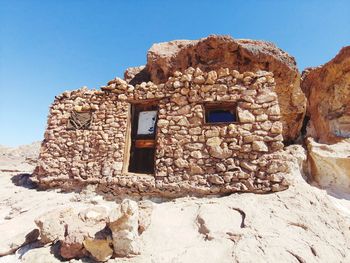 Low angle view of old building against clear sky