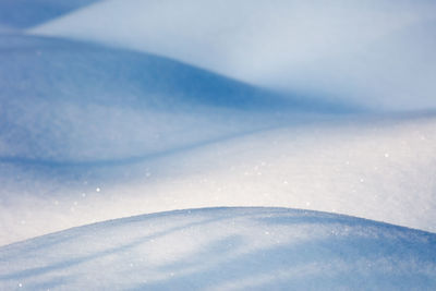 Close-up of snow against sky