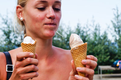 Woman looking at ice cream cone