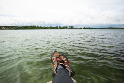 Low section of person by river