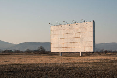 View of empty sign board on field