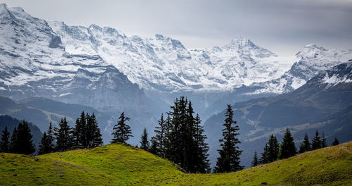 Scenic view of snowcapped mountains against sky