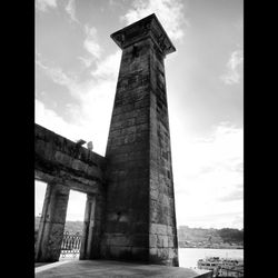 View of bridge against cloudy sky