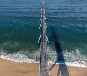 High angle view of deck chairs on beach