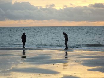 Silhouette of people on beach