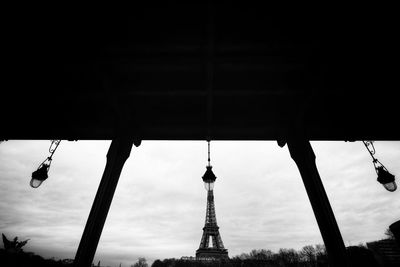 Low angle view of silhouette building against sky