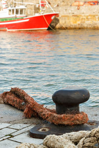 Close-up of boat moored at harbor