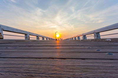 Bridge over sea during sunset
