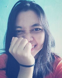 Close-up portrait of a smiling young woman