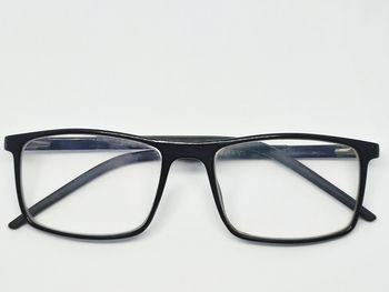 Close-up of eyeglasses against white background