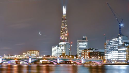 Illuminated buildings in city at night