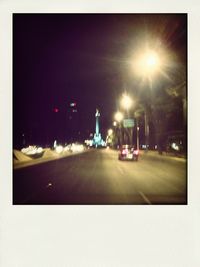 Illuminated street light at night