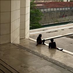 Woman standing by railing