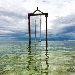 Close-up of swing in sea