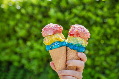 Close-up of hand holding ice cream cone