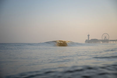 Scenic view of sea against clear sky during sunset