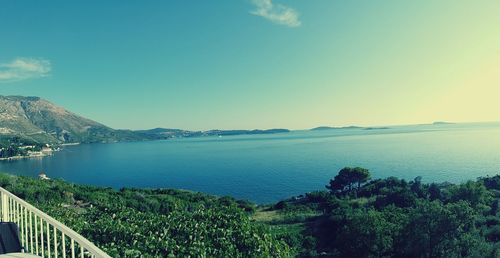 Scenic view of sea against clear blue sky