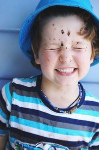 Close-up of boy with dirt on face